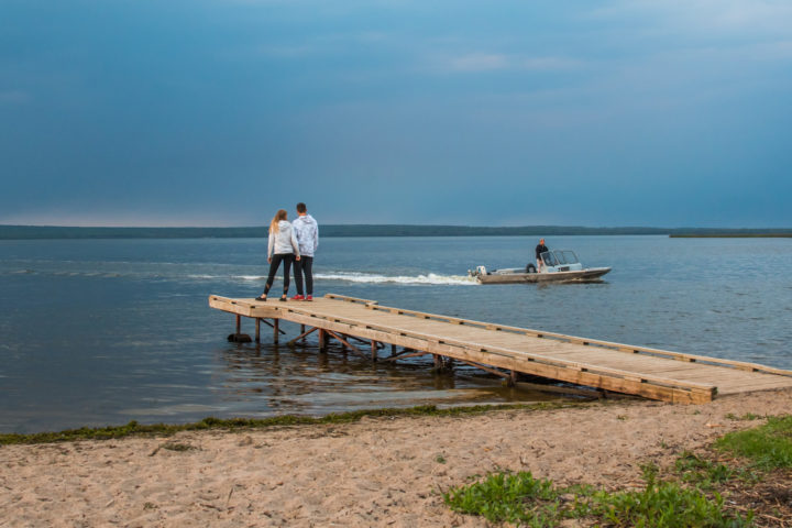 Couple Standing on the Dock at Sturgeon LAke