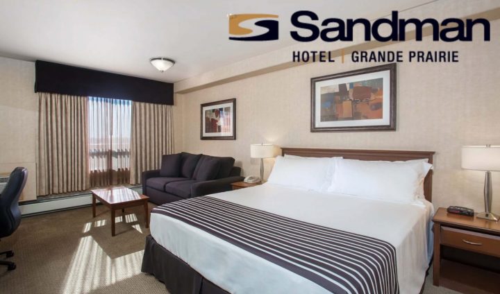 view of hotel room with bed and chair of sandman hotel gp