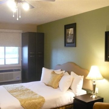 Bedroom at the Brookside Apartment Hotel in Grande Prairie, Alberta.