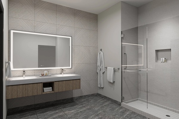 Hotel bathroom with walk-in shower and lighted mirror