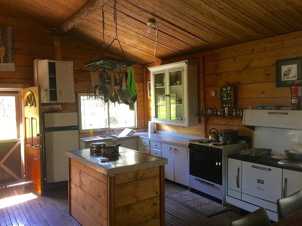 A kitchen inside of a rustic cabin