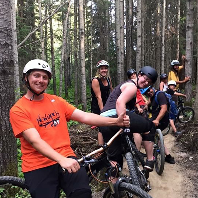 Family going for a bike ride on the trails in Fox Creek