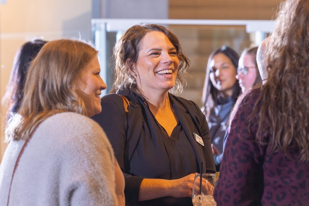 Woman smiling at a business event